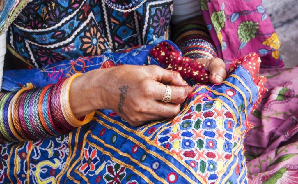 Rajasthan textiles, showcasing intricate weaving, embroidery, and vibrant colors, representing the region's rich cultural heritage
